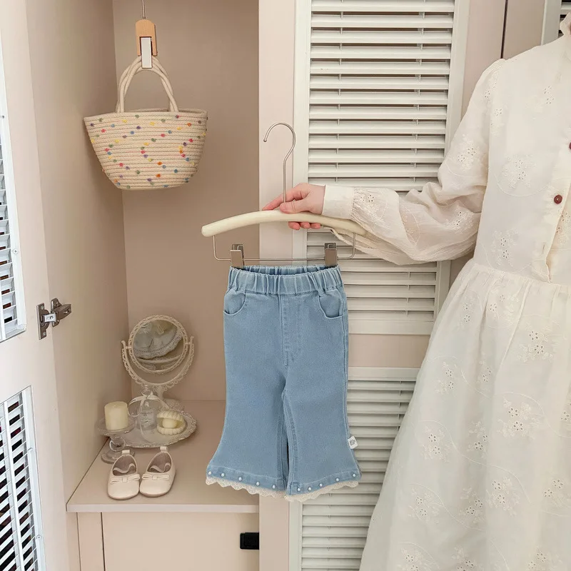 ビーズ飾り裾フレアデニムパンツ
