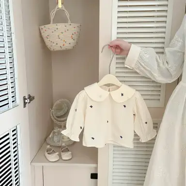 アイボリー トップス