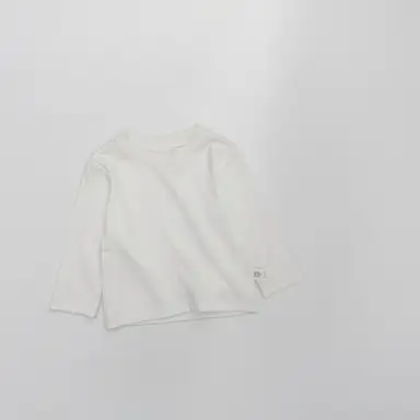 アイボリー トップス