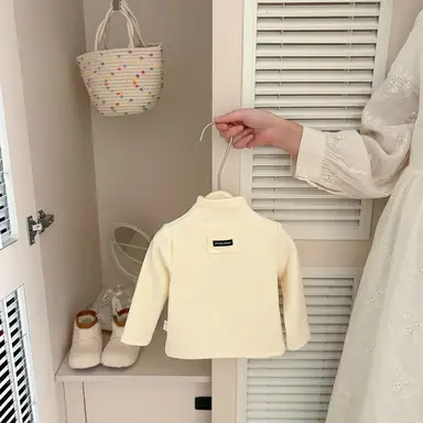 アイボリー トップス